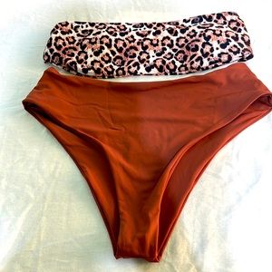 Boutique women’s 2 piece swimsuit. Brown animal print top. Size Small.